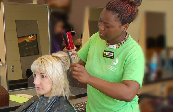 Student getting hair styled at Transitions School of Cosmetology