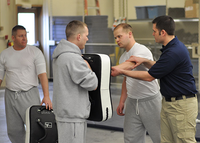students learning tactile maneuver in defense class