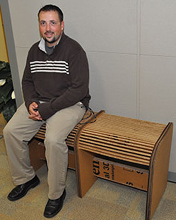 Recycled Cardboard Bench made by MCC Student Shawn Kingsland (pictured).