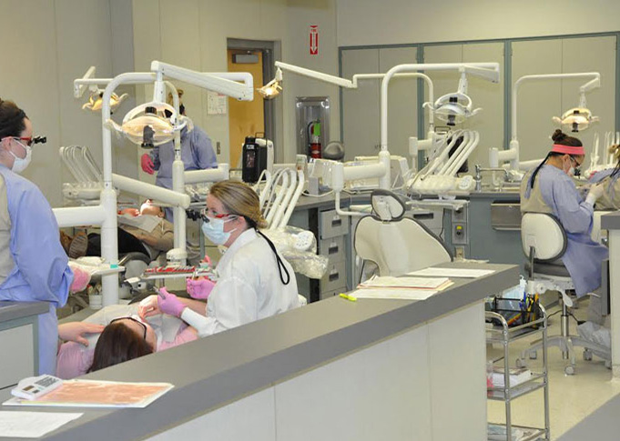 students working Dental Hygiene Clinic under supervision of instructor