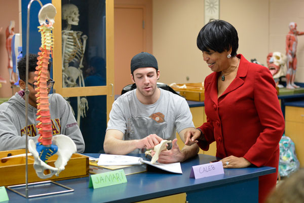 Dr. Beverly conversing with students