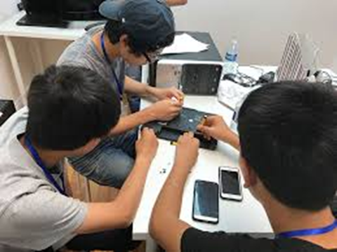 Students working on computer hardware