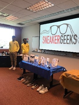Photo of Teen participants presenting business model Sneakergeeks